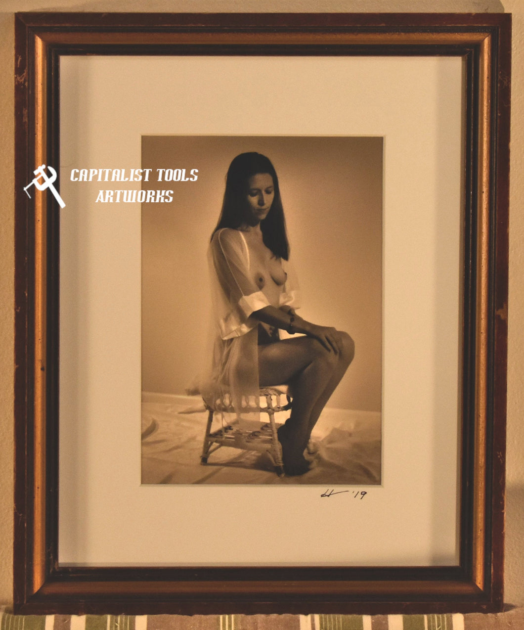 Dianea Seated - 5x7 sepia print in 8x10 frame of young woman in sheer robe seated on antique wicker footstool